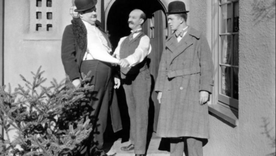 Photo of “Putting Pants on Philip”. Laurel and Hardy and “Coming to America”.